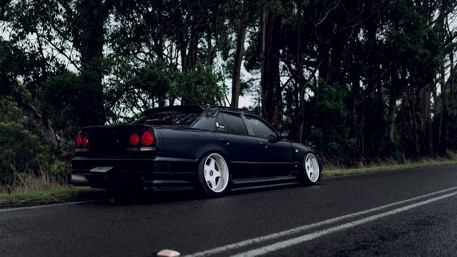 Black Nissan Skyline R34 with JSAI Aero side skirts performance aero body kit