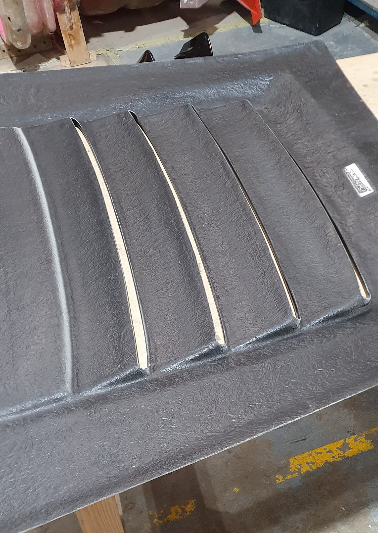 JSAI Aero fiberglass body kit panel during manufacturing process in workshop