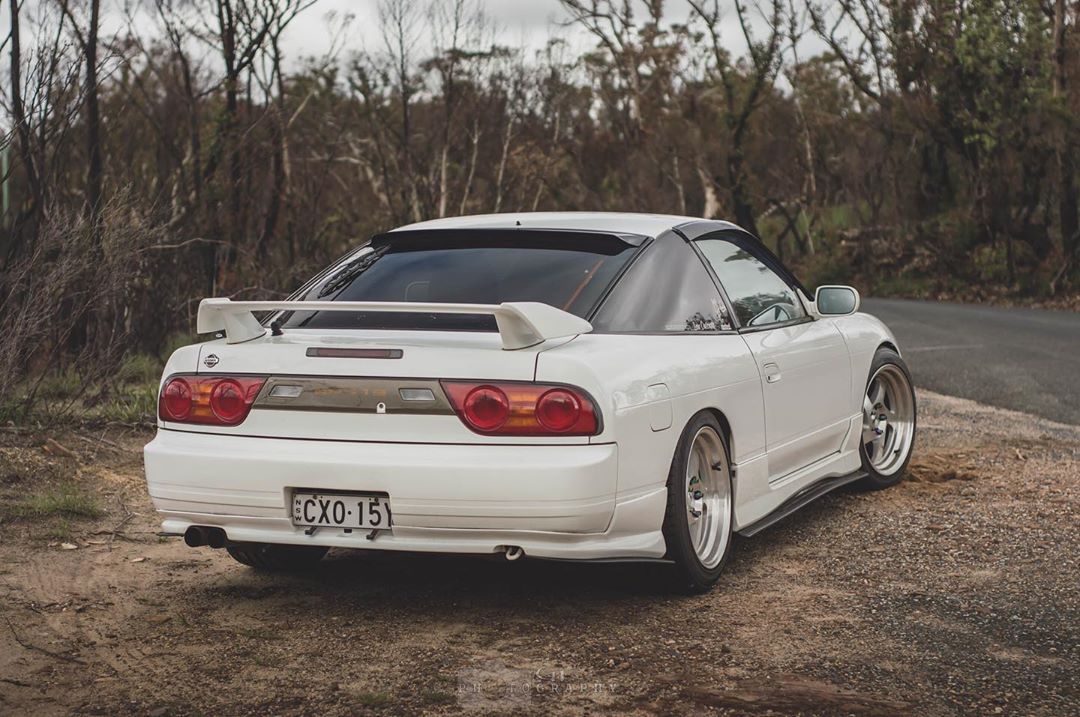 White Nissan 180SX S13 with JSAI Aero performance body kit and rear wing installed