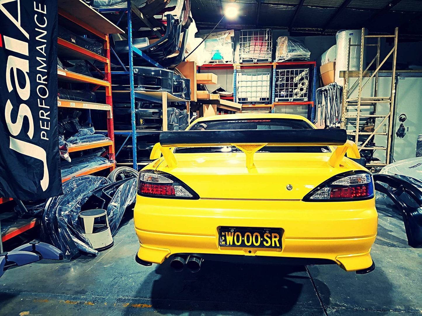 Nissan S15 Silvia rear view with GT wing inside JSAI Aero workshop