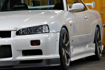 Nissan Skyline GT-R R34 with JSAI AERO front bumper, side skirts, and rear aero enhancements.