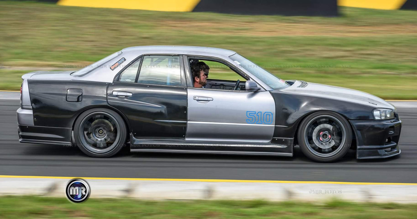 Nissan Skyline R34 with JSAI AERO front bumper, side skirts, and rear aero enhancements.