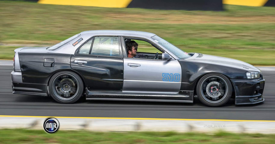 Nissan Skyline R34 with JSAI AERO front bumper, side skirts, and rear aero enhancements.