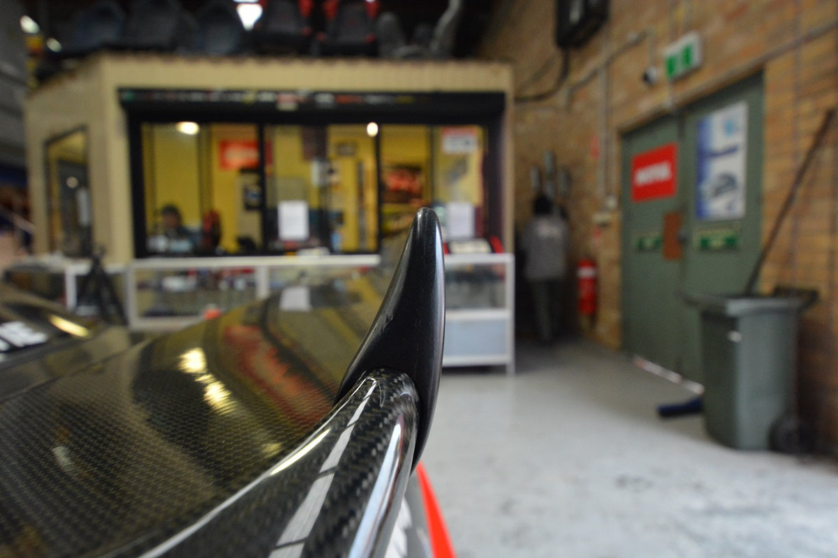 Close-up of a carbon fibre rear wing endplate on a performance car spoiler