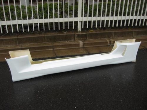 White fibreglass side skirt body kit panel for a performance car
