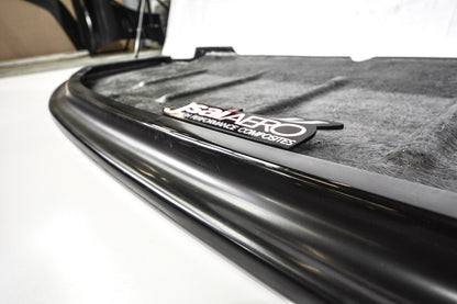 Close-up of JSAI Aero fibreglass body panel edge showing black finished trim and surface detail