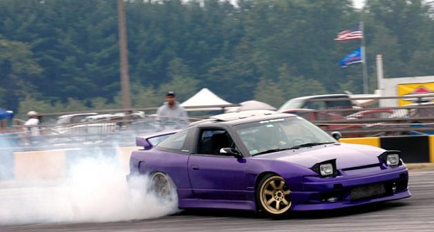 Purple Nissan Silvia S13 drifting with JSAI Aero performance body kit and rear wing
