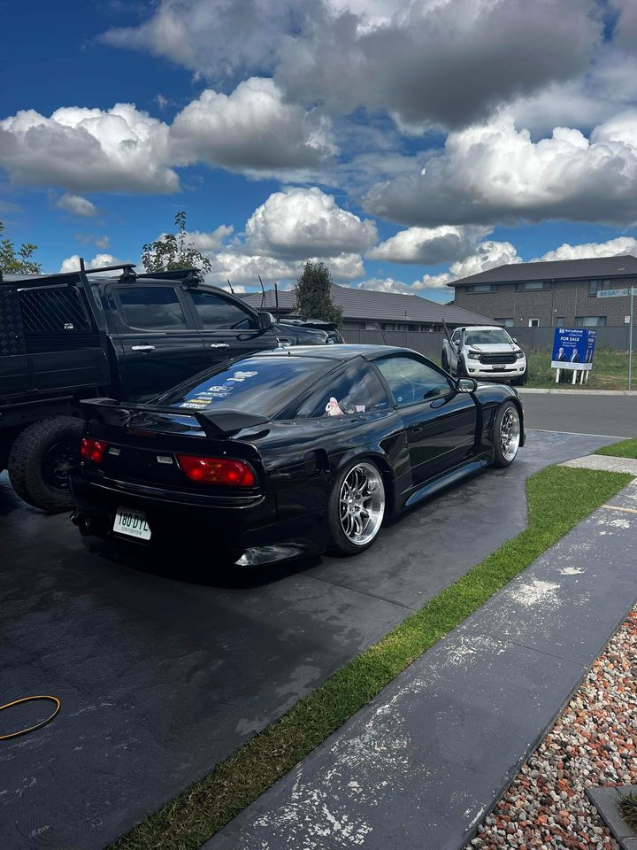 Black Nissan Silvia S13 with JSAI Aero performance body kit and aero parts installed