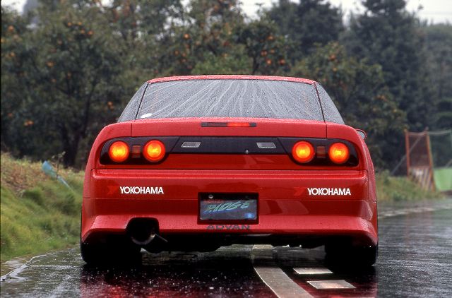 Red Nissan Silvia S13 rear view with JSAI Aero performance body kit and aero styling