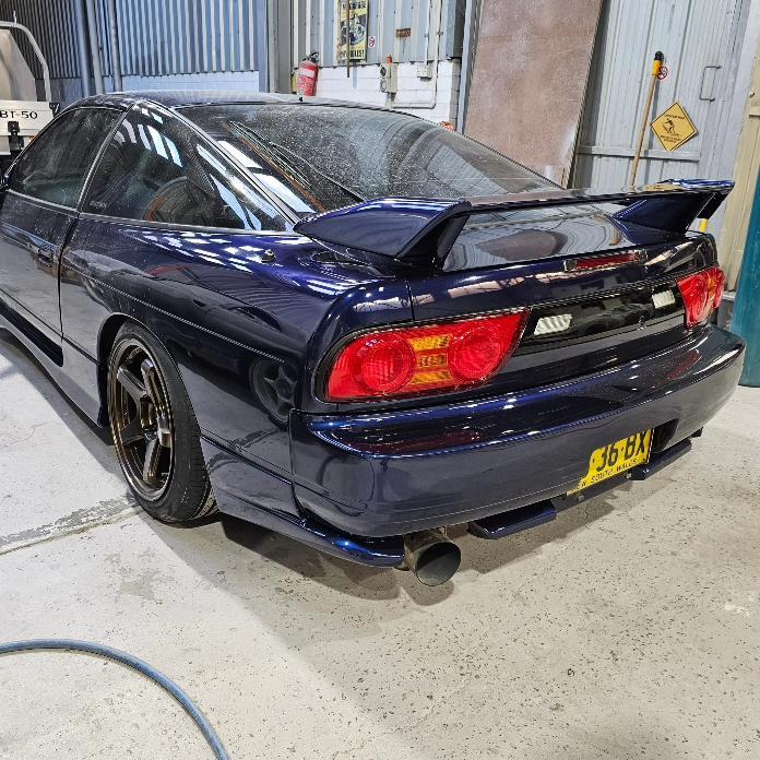 Nissan Silvia S13 rear view with JSAI Aero performance body kit and rear wing installed