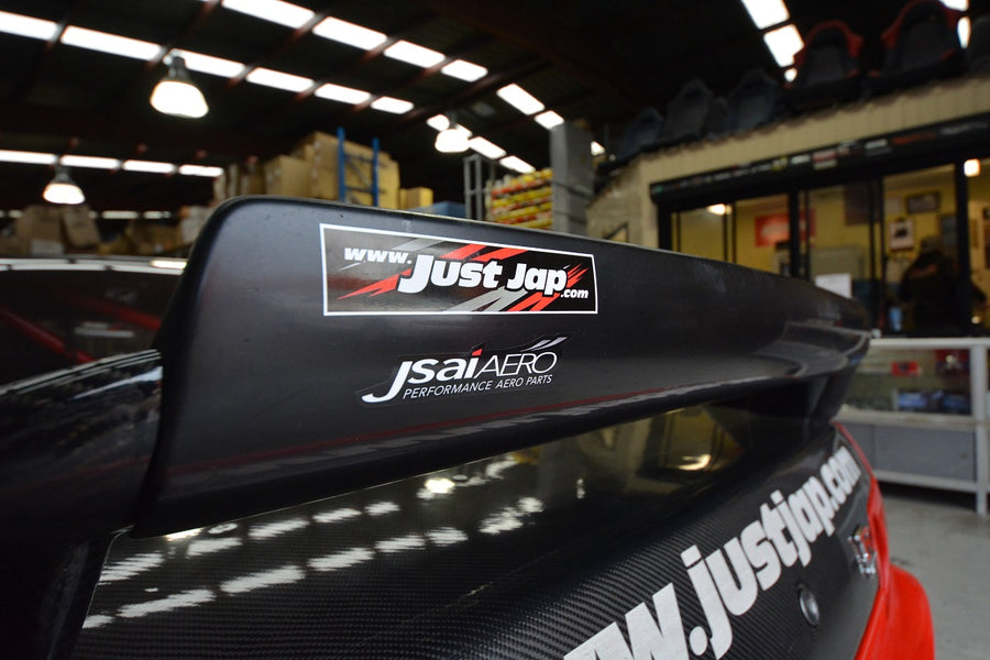 Side view of a JSAI Aero rear wing mounted on a performance car with carbon fibre boot lid