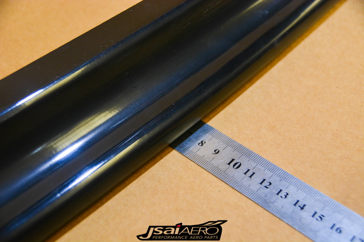Close-up profile detail of a JSAI Aero side skirt with ruler showing depth and shape
