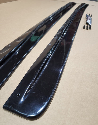 JSAI Aero side skirts pair black aftermarket side skirt extensions angle close-up with mounting hardware detail