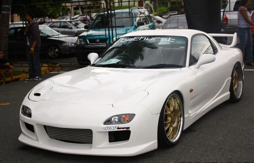 White Mazda RX-7 FD3S with JSAI Aero front bar and side skirts aftermarket body kit front angle view
