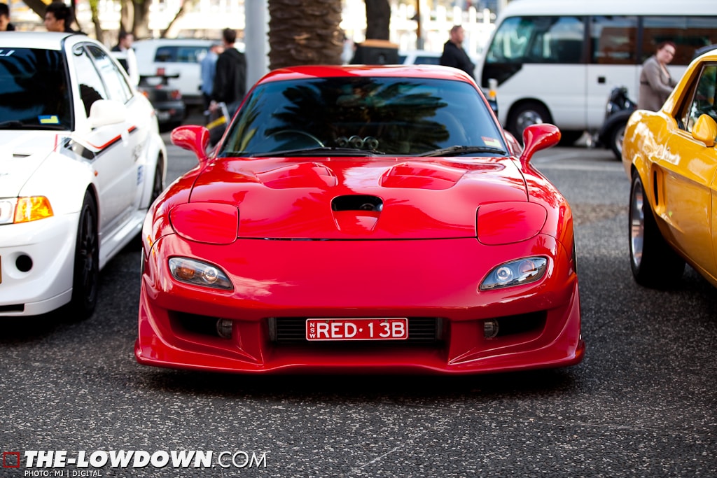 Red Mazda RX-7 FD3S with JSAI Aero front lip aftermarket body kit front view show car