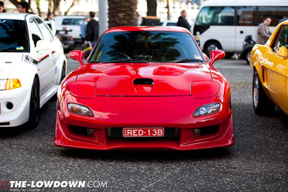 Red Mazda RX-7 FD3S with JSAI Aero front lip aftermarket body kit front view show car