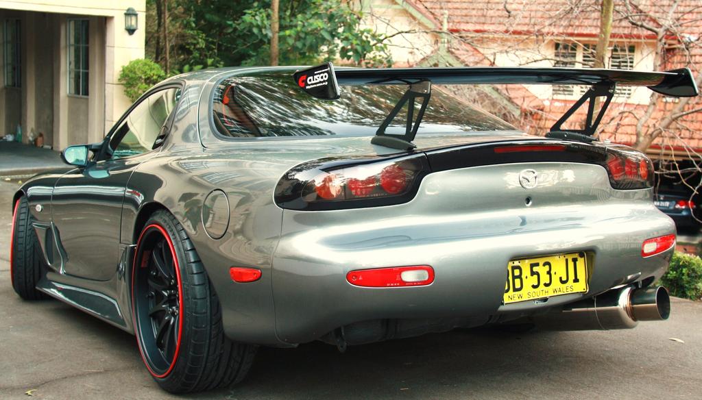 Mazda RX-7 FD3S with JSAI Aero rear lip and side skirts aftermarket body kit rear angle view with wing installed