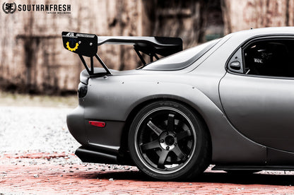 Close-up rear side view of Mazda RX-7 FD3S with JSAI Aero rear lip and side skirts aftermarket body kit with wing installed
