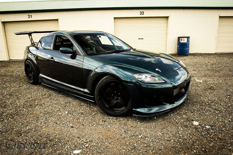 Mazda RX-8 drift car with JSAI Aero body kit performing drift on track motorsport action shot