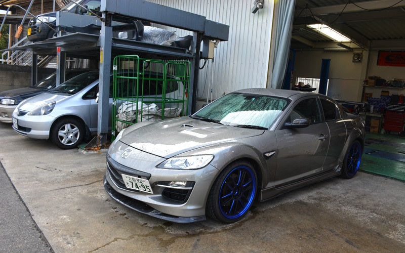 Grey Mazda RX-8 with JSAI Aero front lip and side skirts aftermarket body kit front angle view