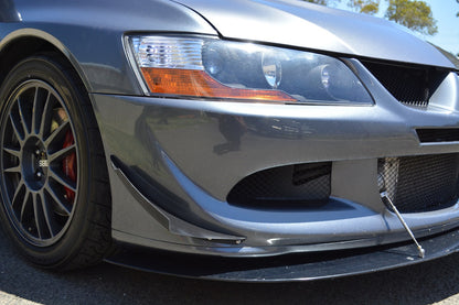 Close-up of Mitsubishi Evo 8 front bumper with JSAI Aero canards and front splitter for improved aerodynamics