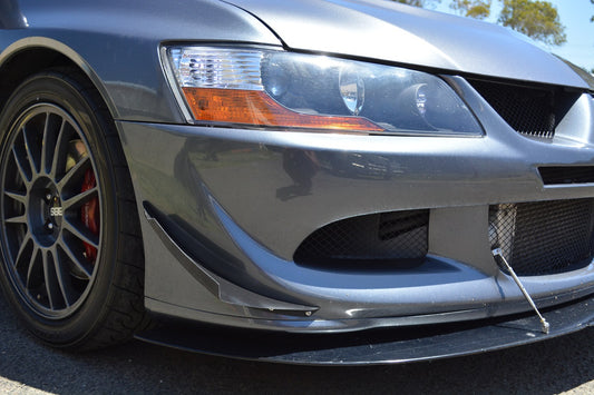 Close-up of Mitsubishi Evo 8 front bumper with JSAI Aero canards and front splitter for improved aerodynamics