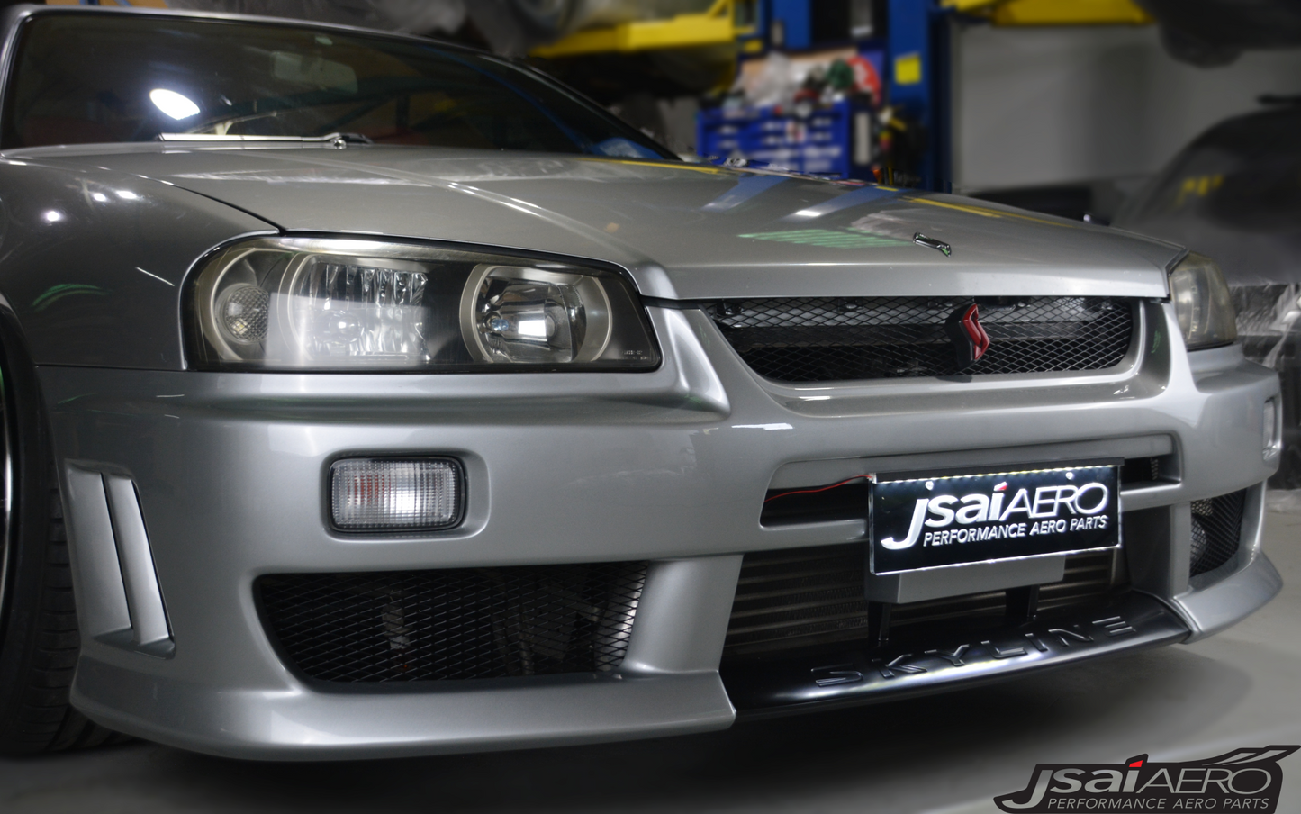 Nissan R34 Altia style front bumper aftermarket body kit angled view