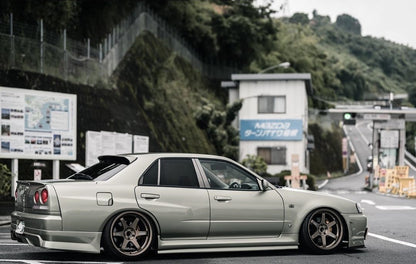 Nissan R34 GTT 4-door Type R style rear over fenders by JSAI featuring wide body aero upgrade and aggressive rear styling