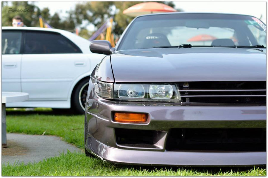 Close-up front view of Nissan S14 Silvia 200SX with aftermarket aero front bumper body kit