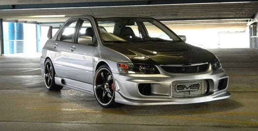 Front angle view of silver Nissan S14 Silvia 200SX with Navan style side skirts aftermarket body kit installed