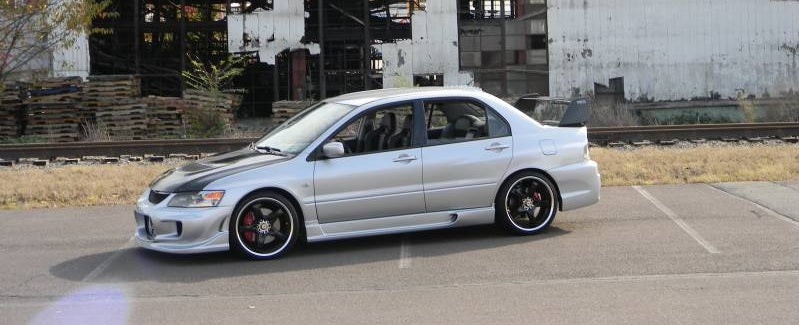 Silver Nissan S14 Silvia 200SX with Navan style side skirts installed aftermarket body kit side view