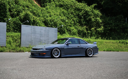 Nissan S14 Silvia 200SX with Vertex style aero kit and lowered stance side view