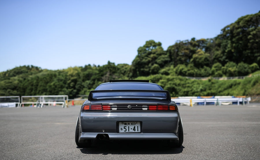 Rear view of Nissan S14 Silvia 200SX with Vertex style aero kit and lowered stance