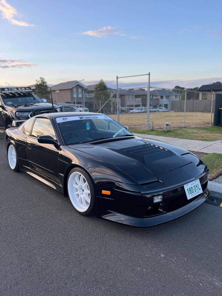Black Nissan Silvia S13 with JSAI Aero performance body kit and front aero styling