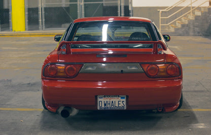 Red Nissan Silvia S13 rear view with JSAI Aero performance body kit and rear wing installed