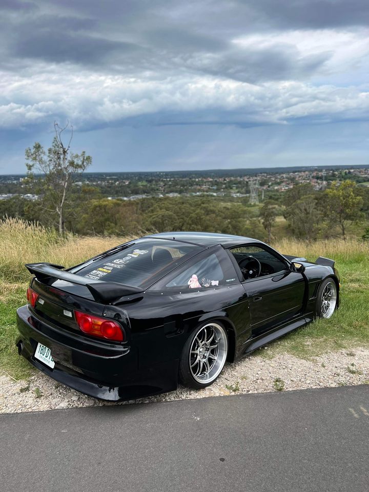 Black Nissan Silvia S13 with JSAI Aero performance body kit and aero parts installed