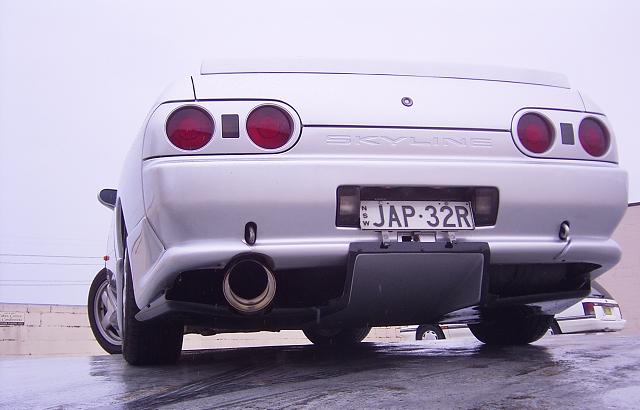 Low rear angle view of Nissan Skyline R33 GT-R with performance exhaust