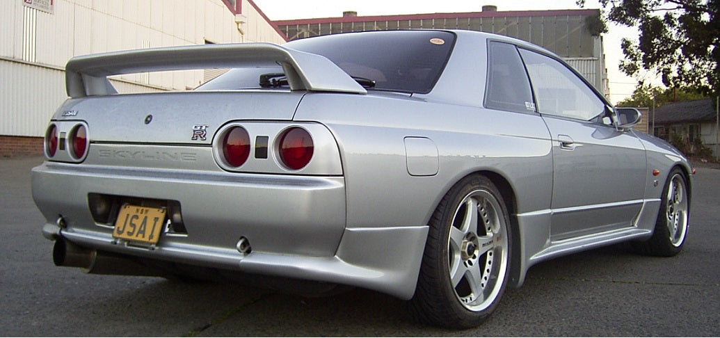 Rear angle view of Nissan Skyline R33 GT-R with GT wing and aero body kit