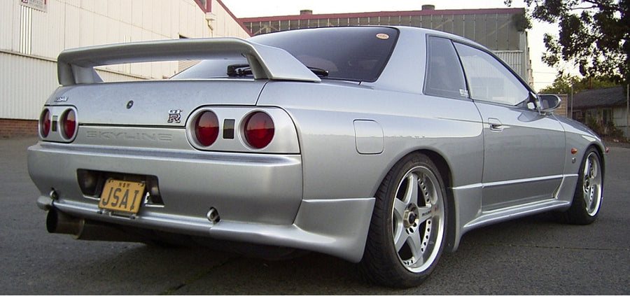 Rear angle view of Nissan Skyline R33 GT-R with GT wing and aero body kit