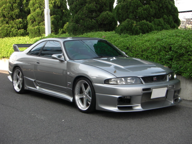 Front angle view of Nissan Skyline R33 GTS-T with aero body kit