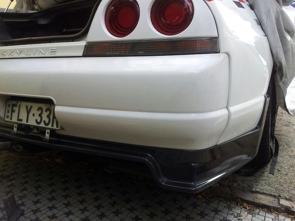 Close-up of Nissan Skyline R33 rear bumper with aero spats