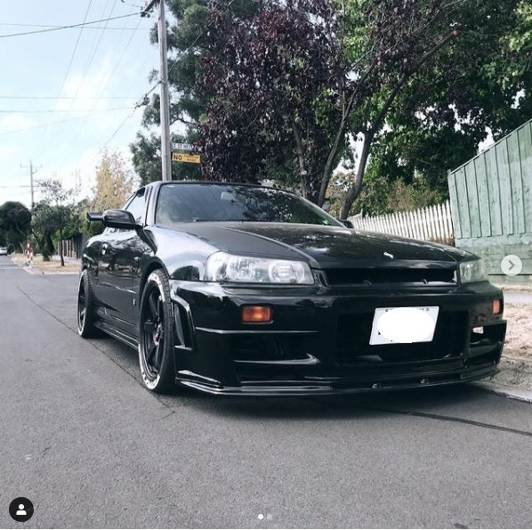 Nissan Skyline R34 front bumper by JSAI featuring aerodynamic performance upgrade and aggressive front-end styling