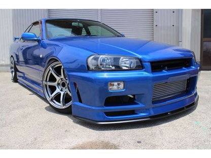 Blue Nissan Skyline GT-R R34 with JSAI Aero front bumper and performance aero body kit