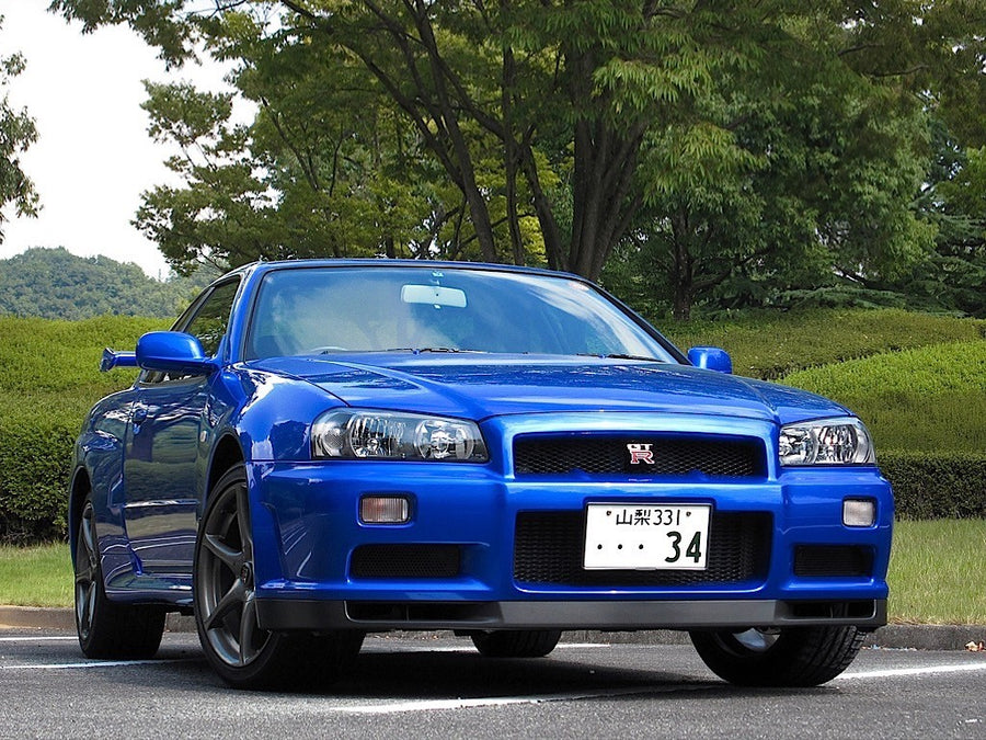 Front three-quarter view of blue Nissan Skyline R34 GT-R
