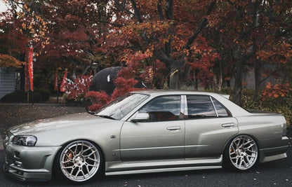 Nissan Skyline R34 GTT 4-door Type R style rear over fenders by JSAI featuring wide body aero upgrade and aggressive rear styling