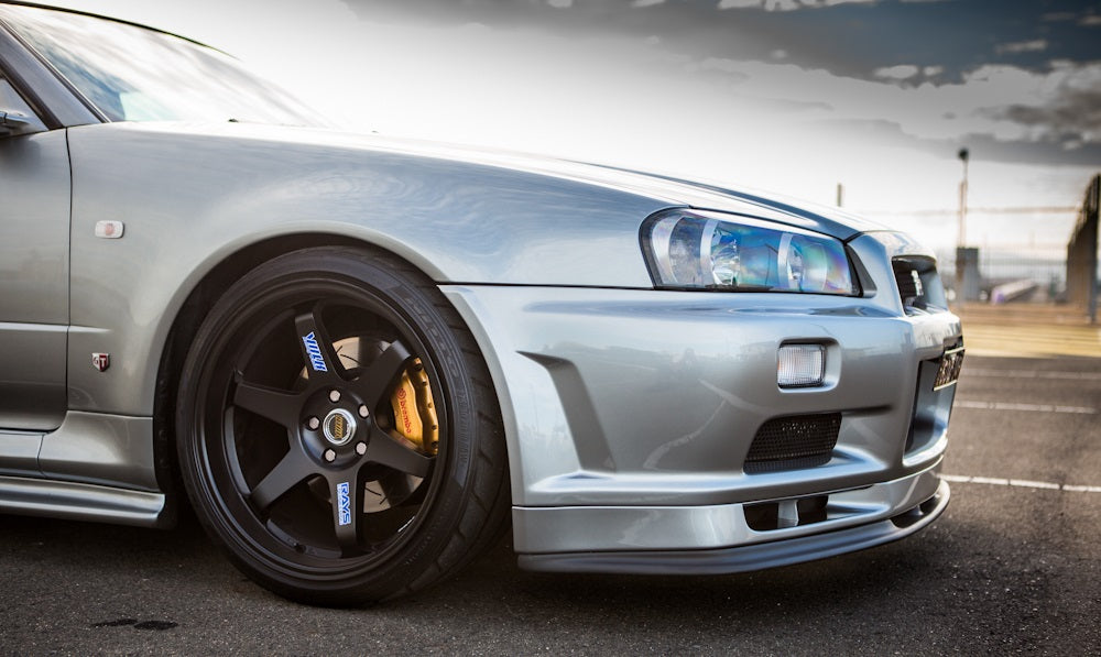 Close-up of Nissan Skyline R34 with JSAI Aero front lip and front bumper body kit