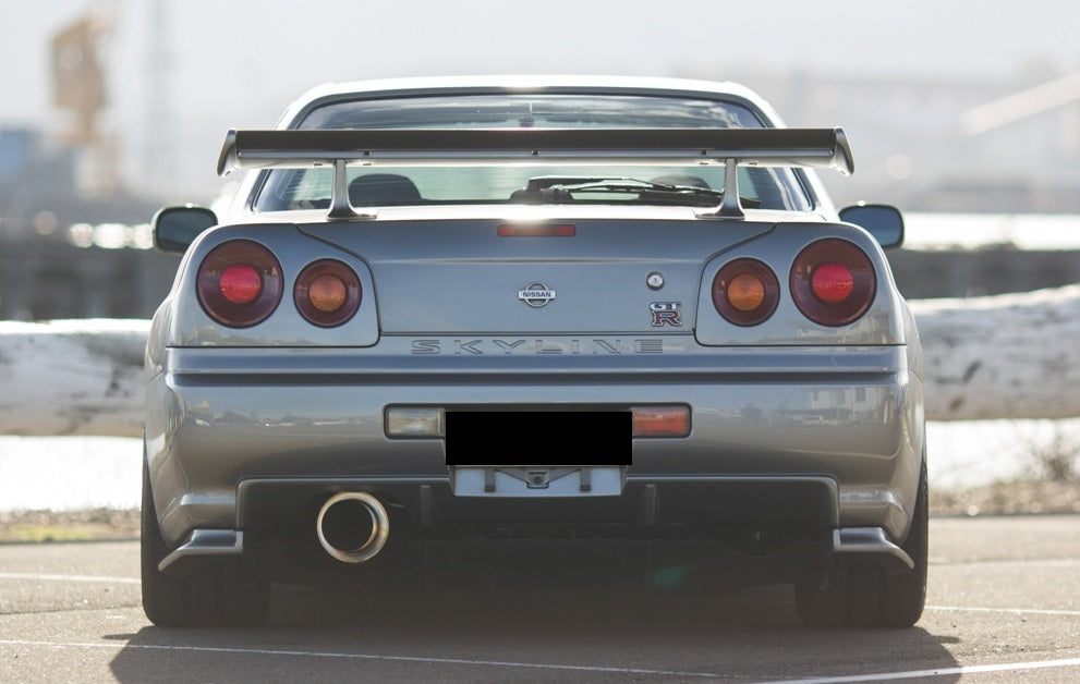 Rear view of Nissan Skyline R34 with JSAI Aero body kit and GT wing