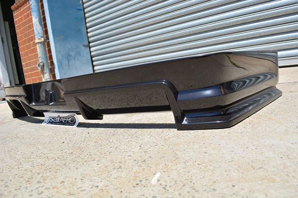 Low angle view of JSAI Aero rear bumper diffuser for Nissan Skyline R34 aftermarket body kit