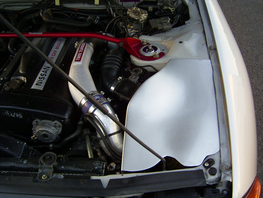 Nissan Skyline RB engine bay with intake piping and strut brace