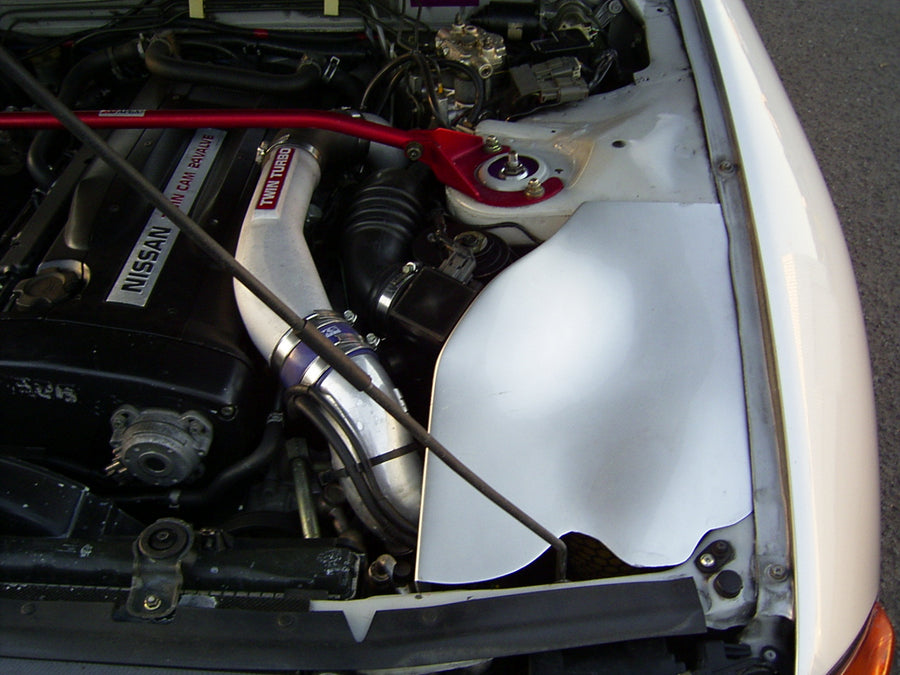 Nissan Skyline RB engine bay with intake piping and strut brace